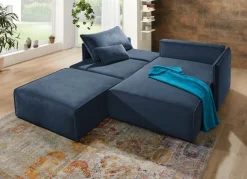 Polsterecke mit Bettfunktion und Hocker